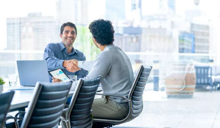 businessmen shake hands to close a deal